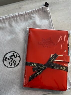 Hermes Orange notebook with pen.  Bonus dustbag!